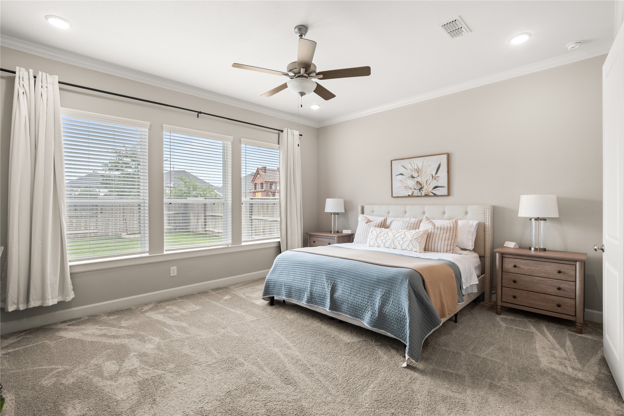 3118 Swift Way Katy, TX 77493 - Photo 17 of 34 Primary Bedroom – Spacious primary suite with plush carpeting, multiple windows for natural light, and a calming, neutral color palette.