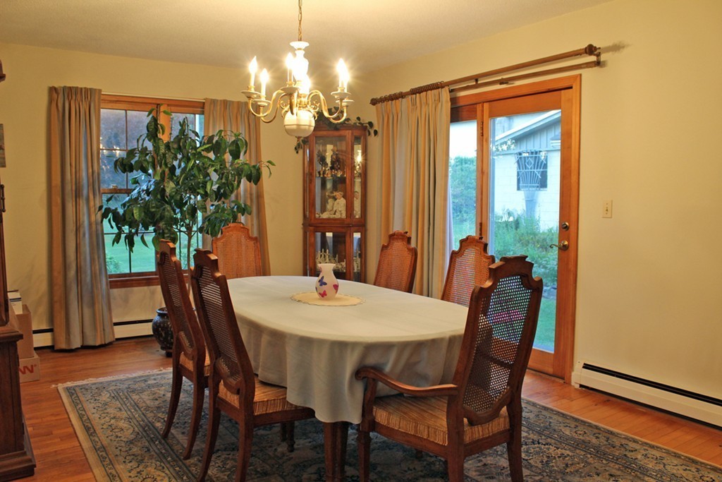 70 Buckland Road Ashfield, MA 01330 - Photo 11 of 30 a view of a dining room with furniture and chandelier