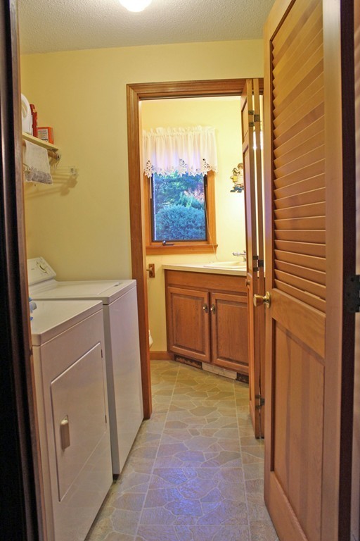 70 Buckland Road Ashfield, MA 01330 - Photo 16 of 30 a view of a bathroom with a tub and a window