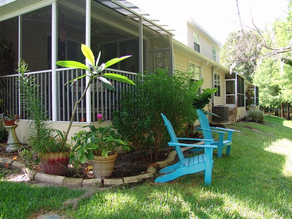 1605 Send Way Lutz, FL 33549 - Photo 14 of 24 a view of a house with backyard sitting area and garden