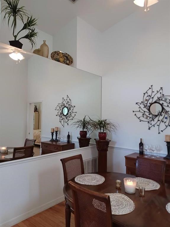 1605 Send Way Lutz, FL 33549 - Photo 8 of 24 a dining room with furniture and wooden floor