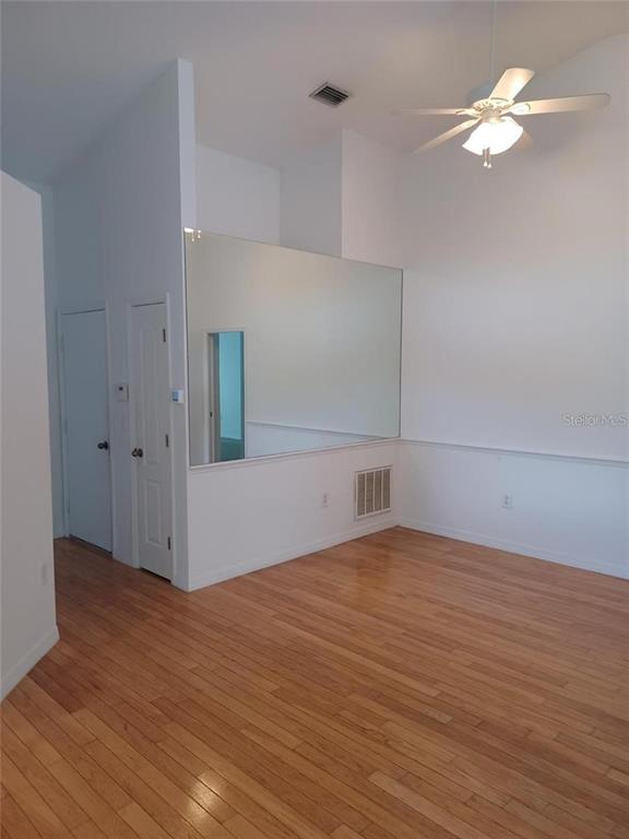 1605 Send Way Lutz, FL 33549 - Photo 10 of 24 wooden floor in an empty room