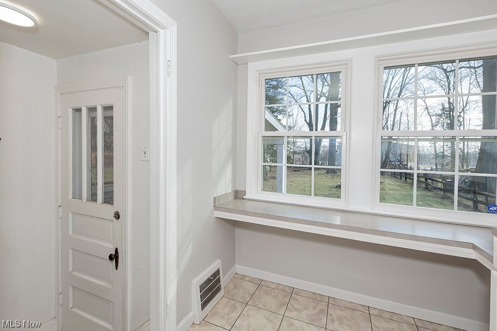 863 Roland Road Cleveland, OH 44124 - Photo 14 of 32 Built-in kitchen seating with windows looking out onto dream back yard.