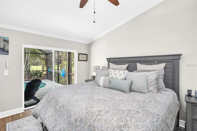 a bedroom with a large bed and a large window