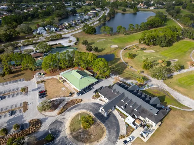 an aerial view of residential house with outdoor space and swimming pool