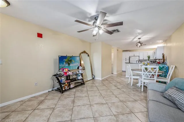 a living room with furniture and white walls