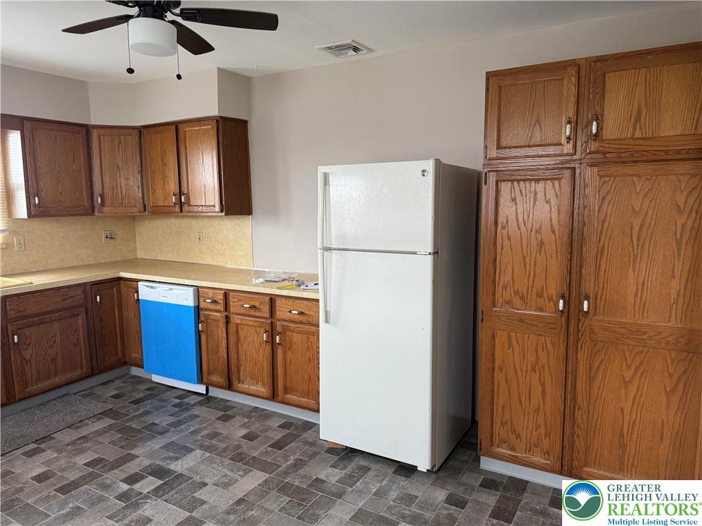 637 5th Street Whitehall, PA 18052 - Photo 7 of 16 a kitchen with stainless steel appliances granite countertop a refrigerator a sink and dishwasher