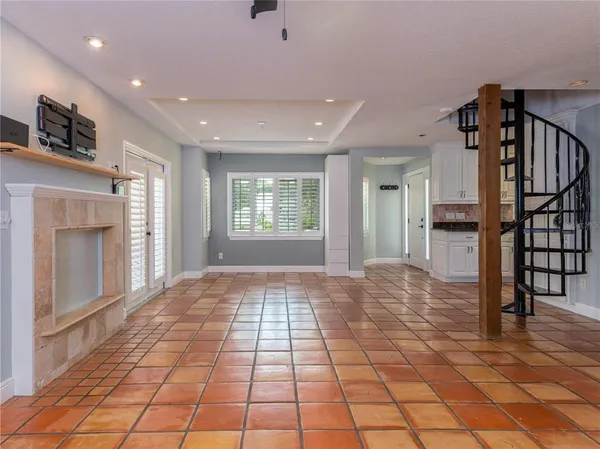 a view of an entryway of a house and livingroom with furniture