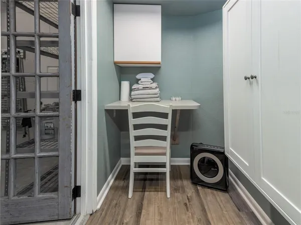 a view of a hardwood & utility room
