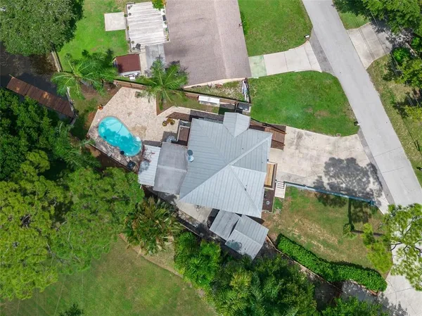 an aerial view of a house with outdoor space