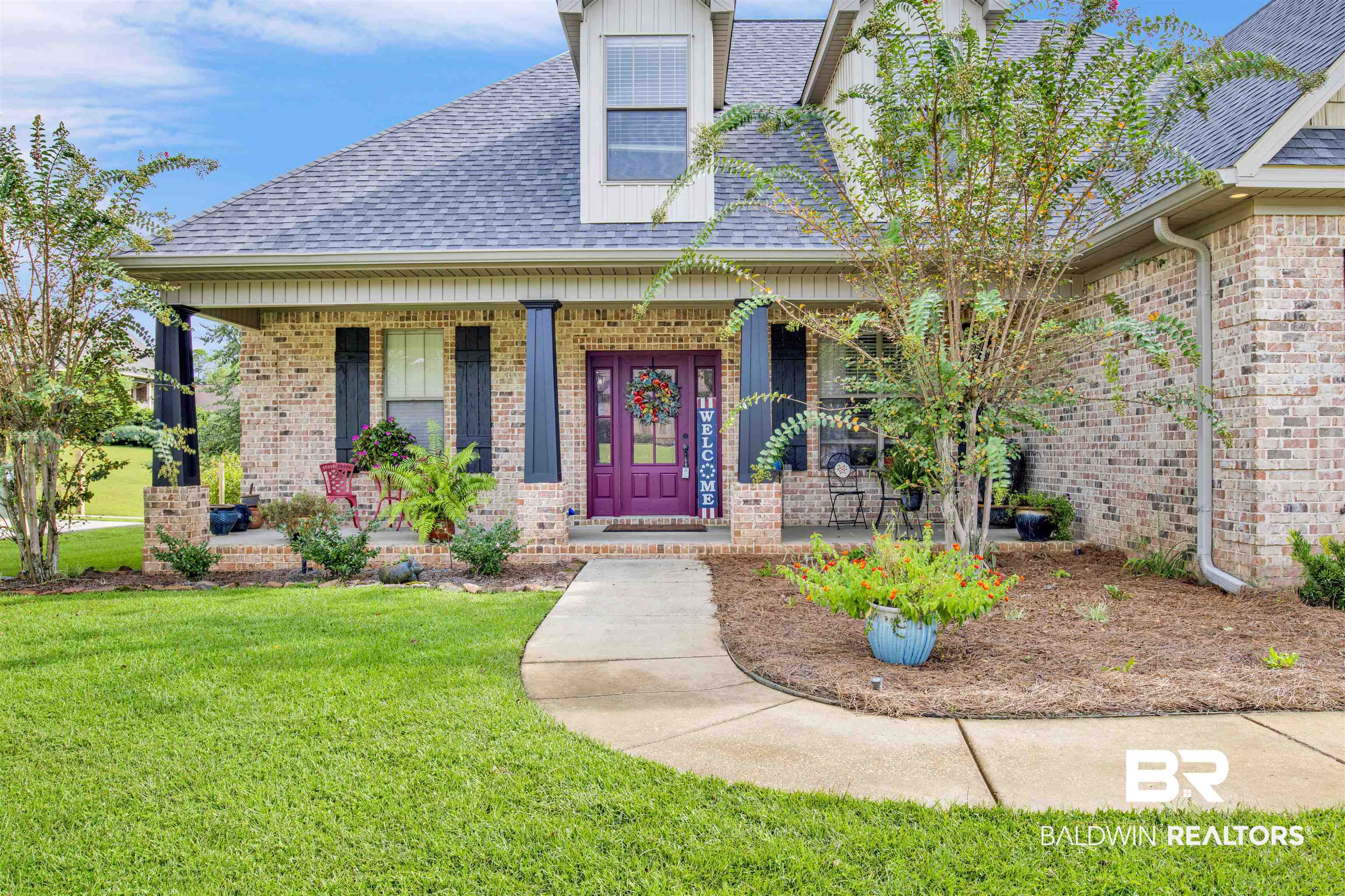 12418 Cambron Trail Daphne, AL 36527 - Photo 2 of 44 Exterior space with a front yard and a porch