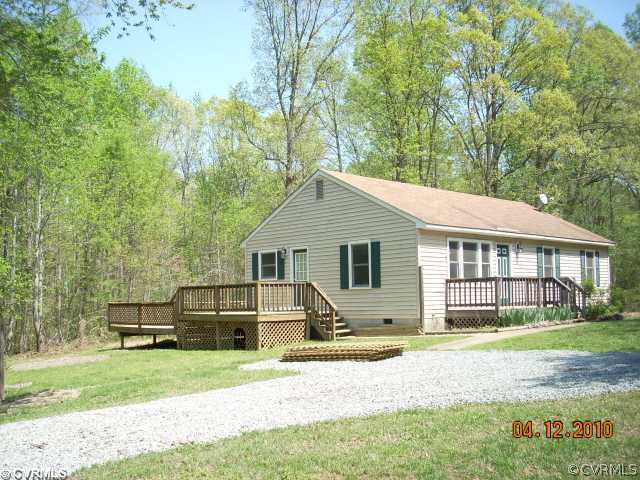 311 Dusty Road Bumpass, VA 23024 - Photo 1 of 12 a house view with a garden space