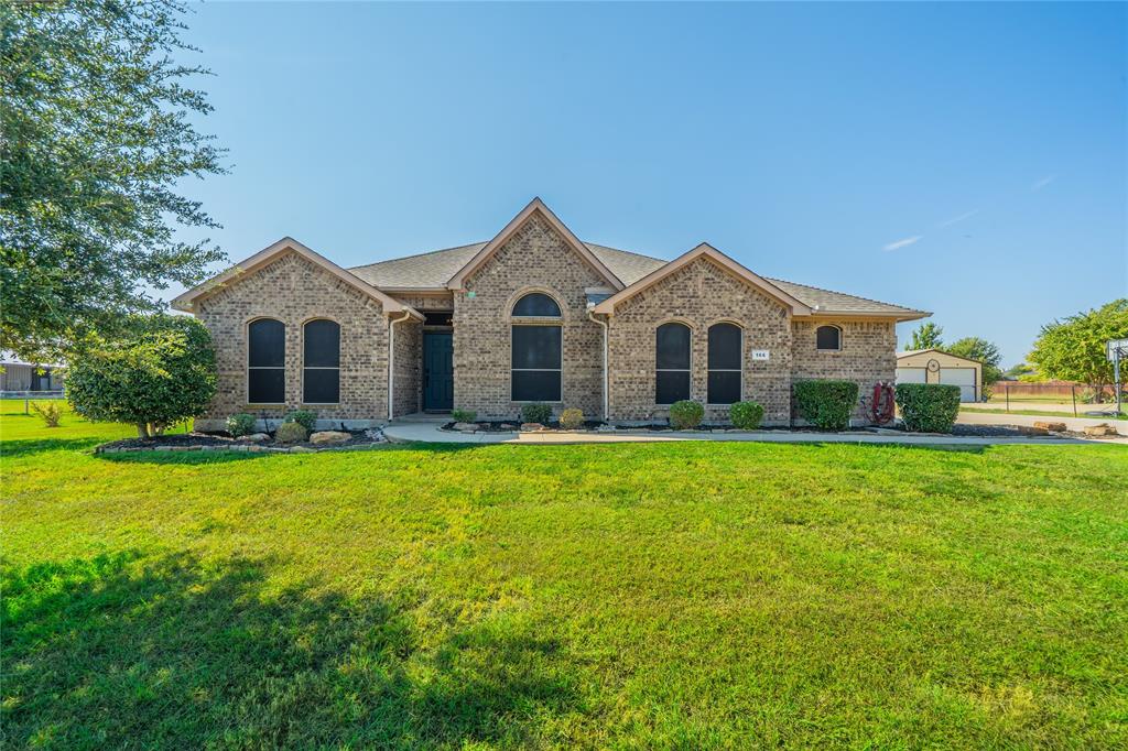 166 Oxford Ranch Road Waxahachie, TX 75167 - Photo 1 of 27 Brick exterior with gabled roof lines, mature trees, and a manicured lawn