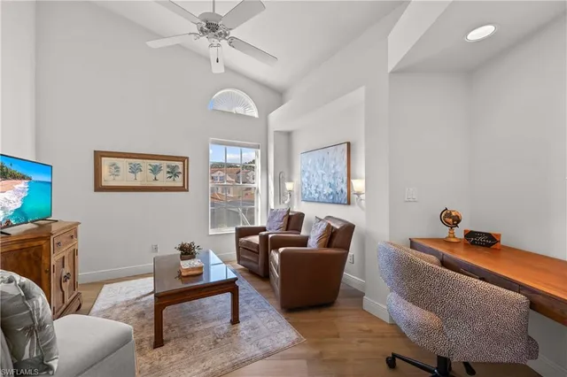 a bedroom with a bed a mirror and a window