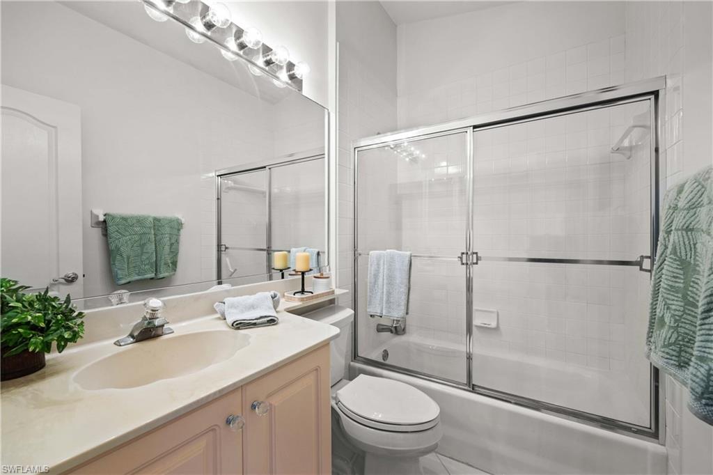 8415 Excalibur Circle, Unit B10 Naples, FL 34108 - Photo 19 of 26 a bathroom with a sink toilet and shower