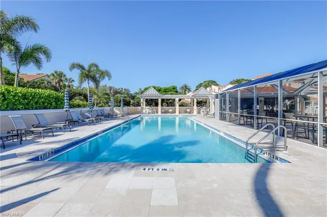 an outdoor space with furniture and lots of tables