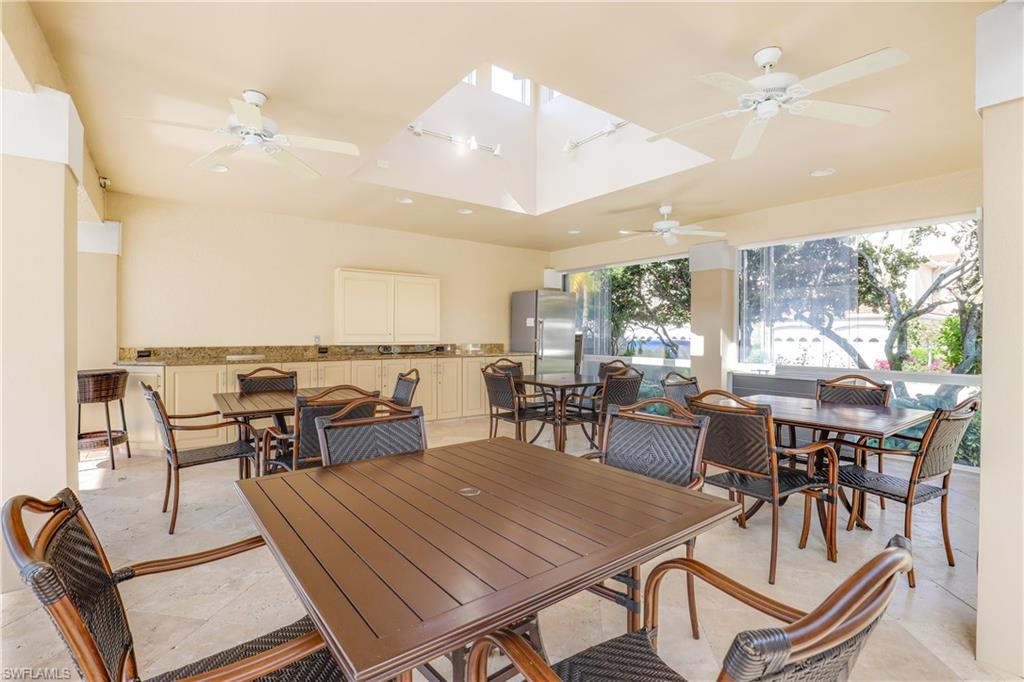 8415 Excalibur Circle, Unit B10 Naples, FL 34108 - Photo 26 of 26 an outdoor space with furniture and lots of tables