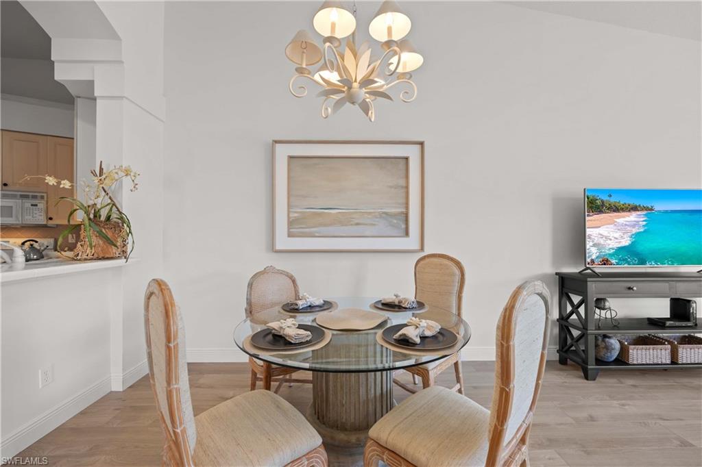 8415 Excalibur Circle, Unit B10 Naples, FL 34108 - Photo 8 of 26 a view of a dining room with furniture