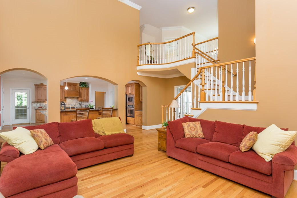 7220 Sunset Glen Point Raleigh, NC 27614 - Photo 10 of 25 Entertaining is easy between the open kitchen, family room and XL screened porch. Family Room