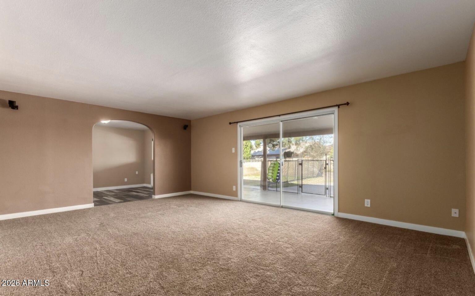 5130 West Redfield Road Glendale, AZ 85306 - Photo 12 of 35 a view of an empty room with a window