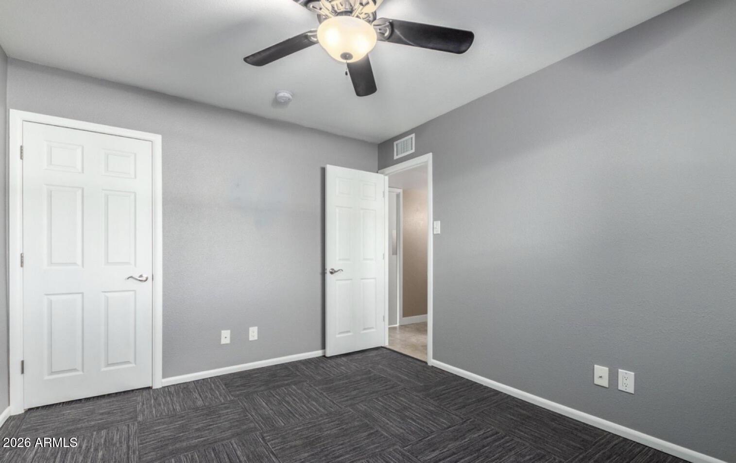 5130 West Redfield Road Glendale, AZ 85306 - Photo 14 of 35 an empty room with chandelier fan