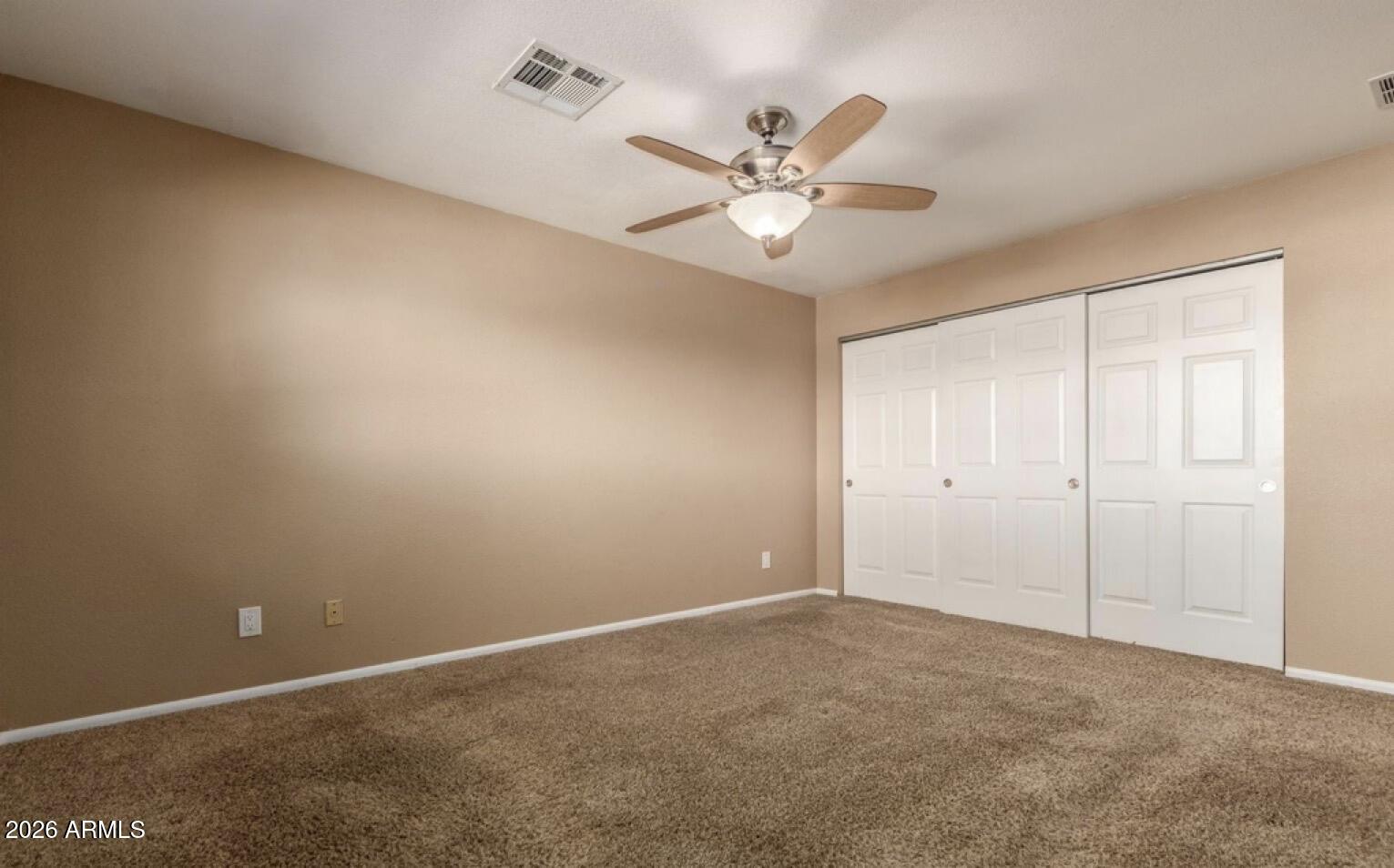 5130 West Redfield Road Glendale, AZ 85306 - Photo 22 of 35 a view of a room with a fan & a window