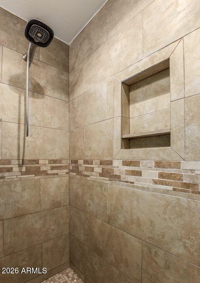 5130 West Redfield Road Glendale, AZ 85306 - Photo 24 of 35 a bathroom with a mirror and a shower