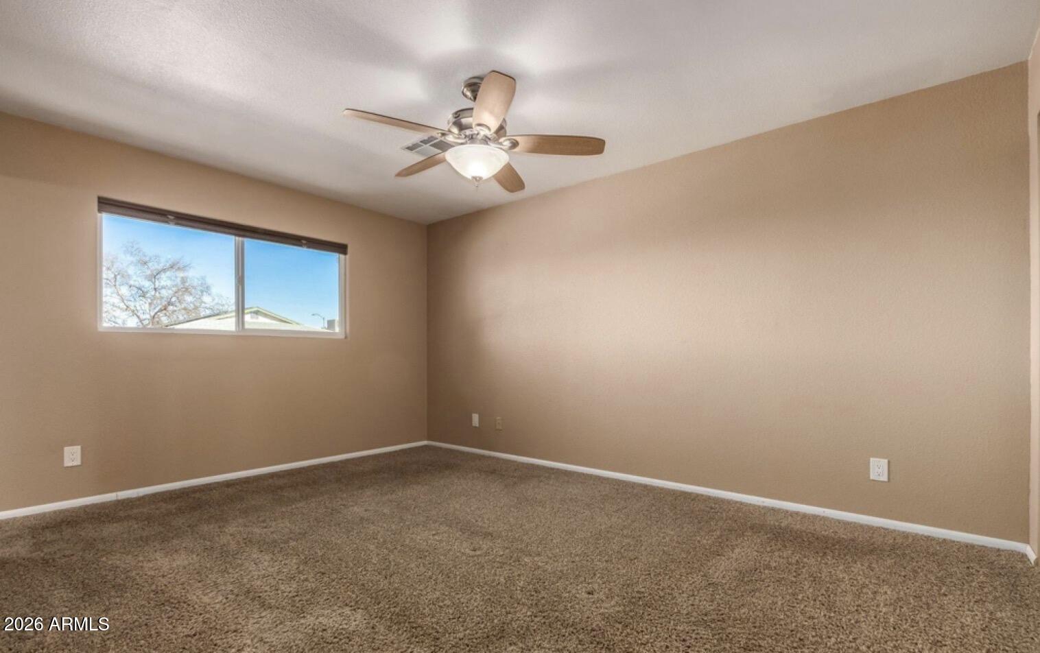 5130 West Redfield Road Glendale, AZ 85306 - Photo 25 of 35 a view of an empty room with a window