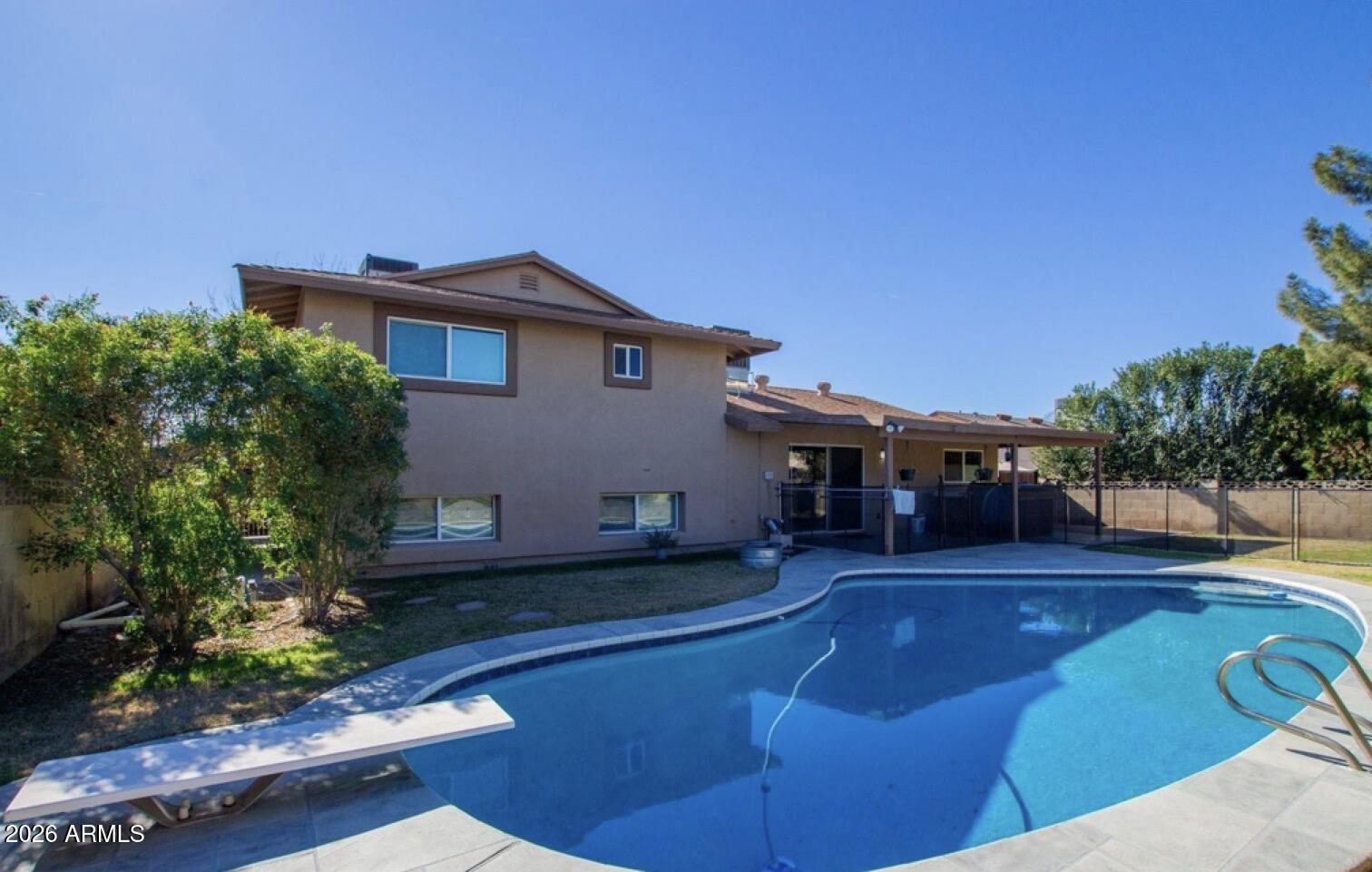 5130 West Redfield Road Glendale, AZ 85306 - Photo 31 of 35 a view of a house with a yard