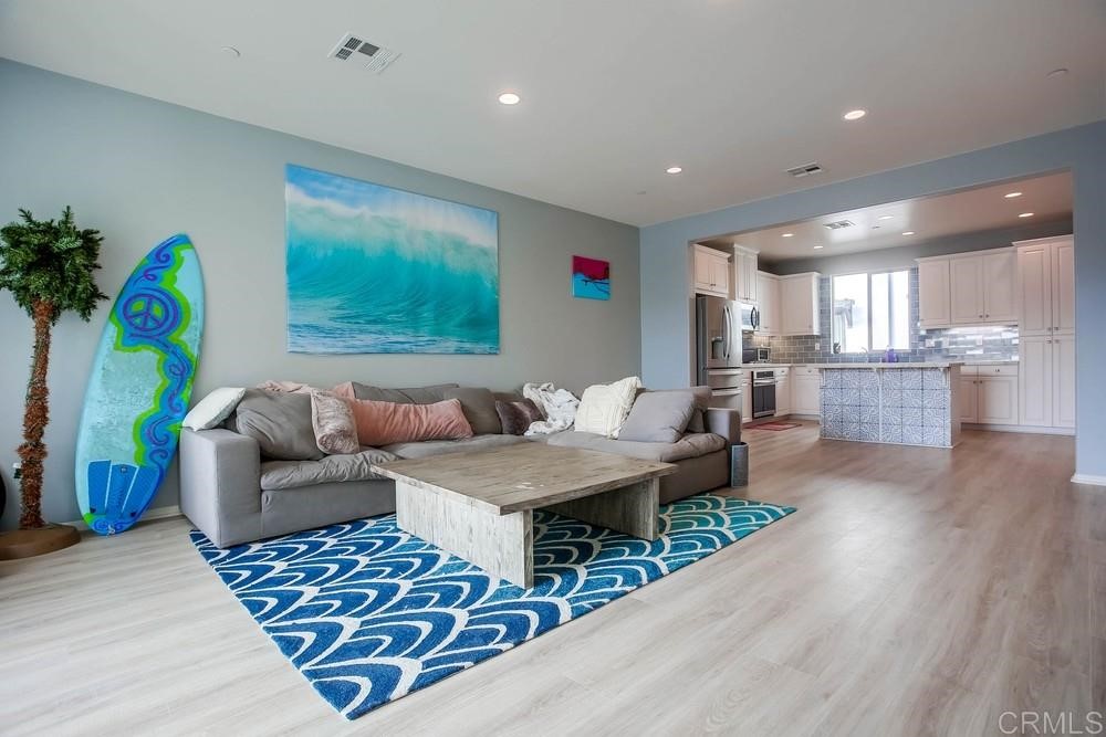 2229 Solara Lane Vista, CA 92081 - Photo 3 of 25 a living room with furniture and a potted plant