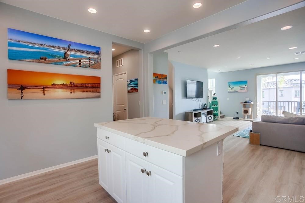 2229 Solara Lane Vista, CA 92081 - Photo 8 of 25 a room with furniture and a flat screen tv