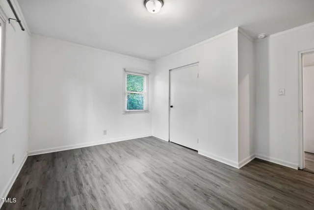 a bath room with a toilet and a bath tub