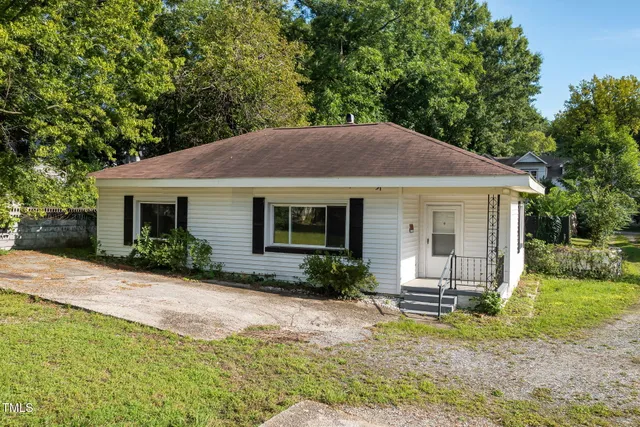 a view of backyard with seating space