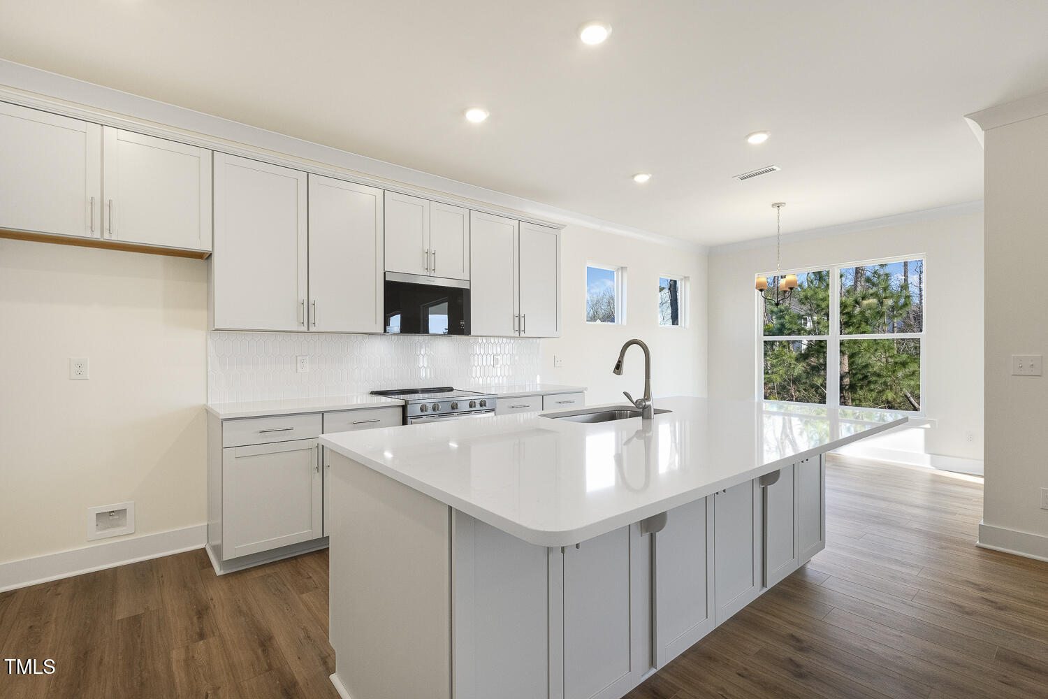 82 Gander Drive Benson, NC 27504 - Photo 11 of 33 a kitchen with stainless steel appliances granite countertop a sink dishwasher a stove and a refrigerator with wooden floor