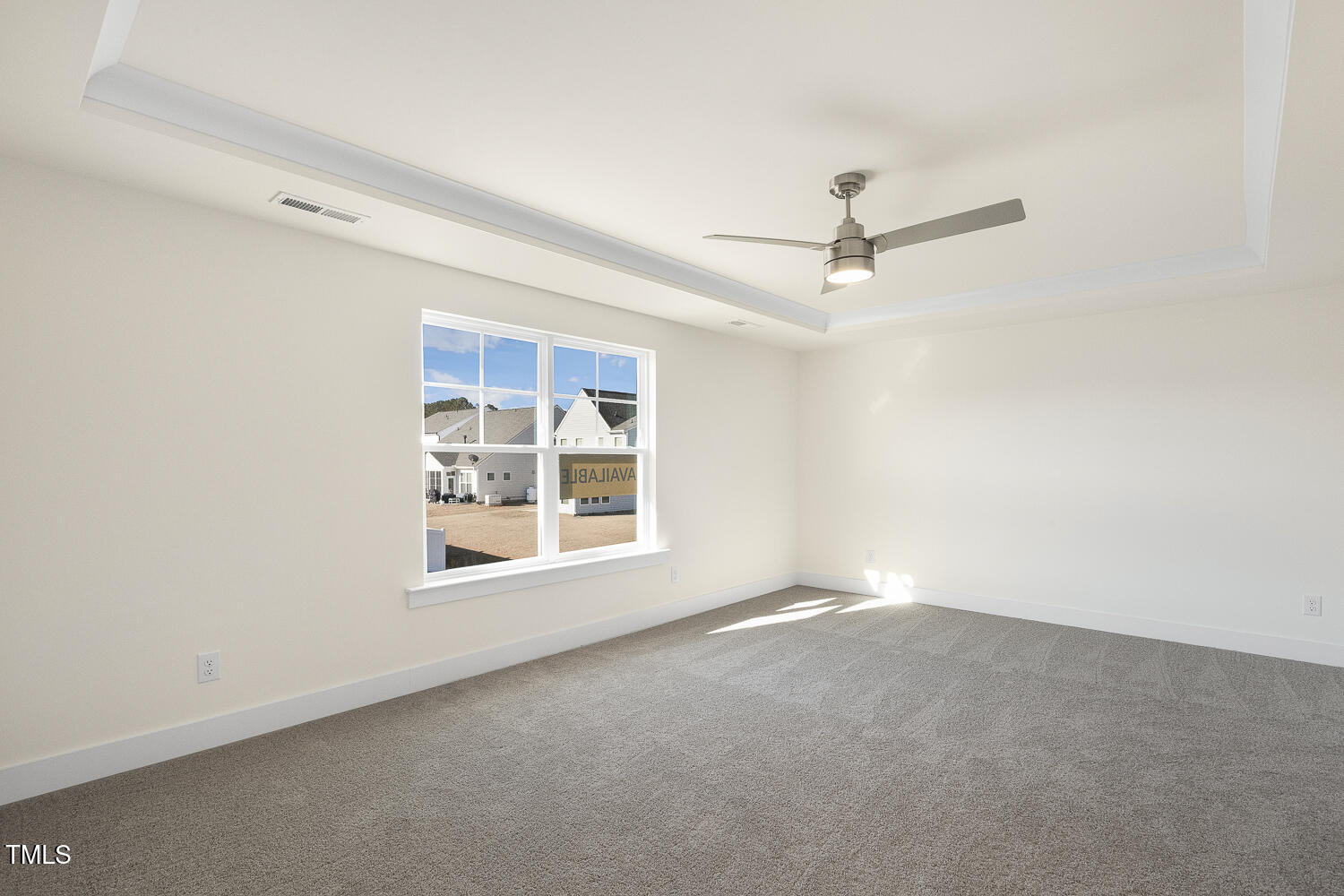 82 Gander Drive Benson, NC 27504 - Photo 13 of 33 an empty room with a window and a ceiling fan