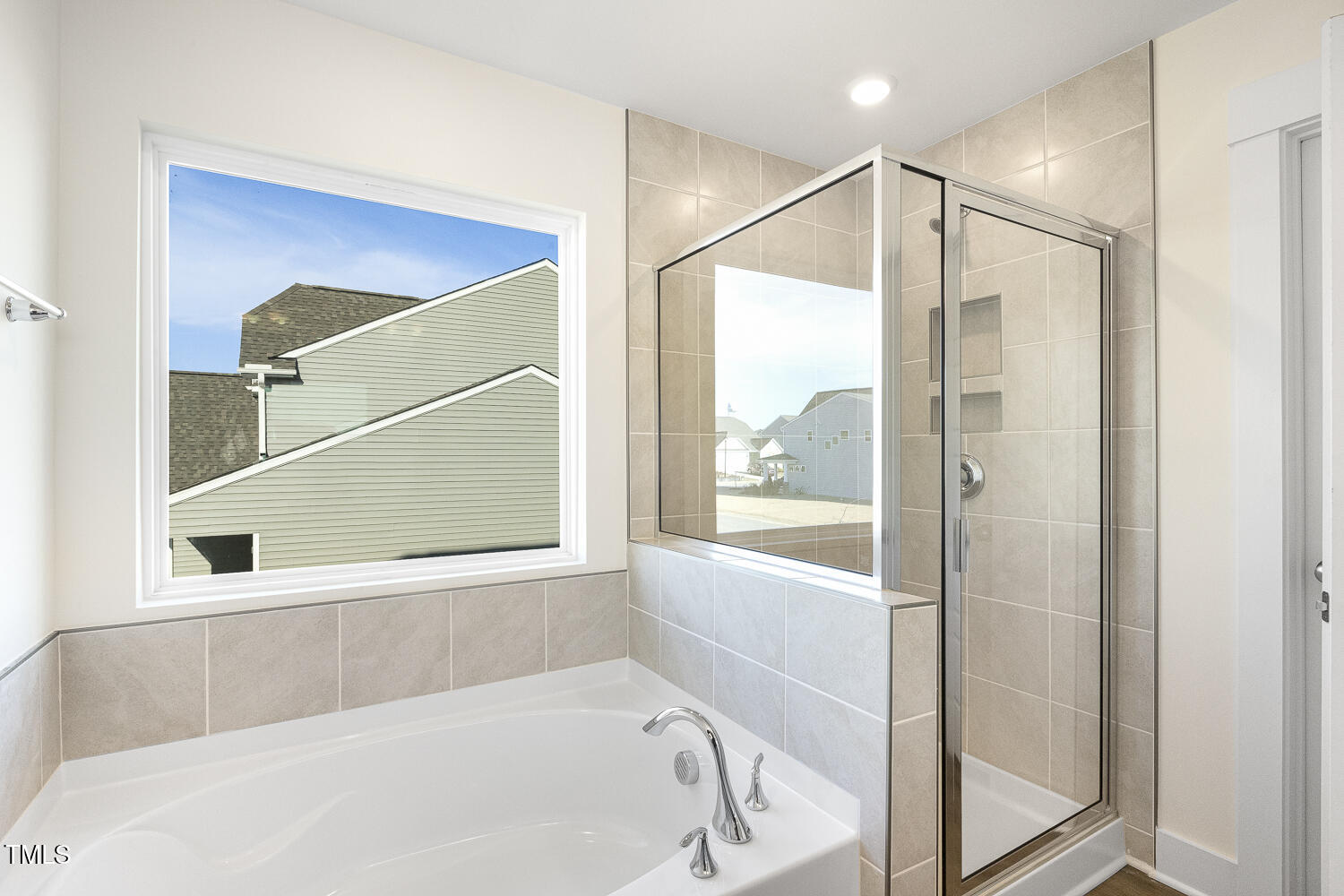 82 Gander Drive Benson, NC 27504 - Photo 16 of 33 a bathroom with a bathtub and a shower