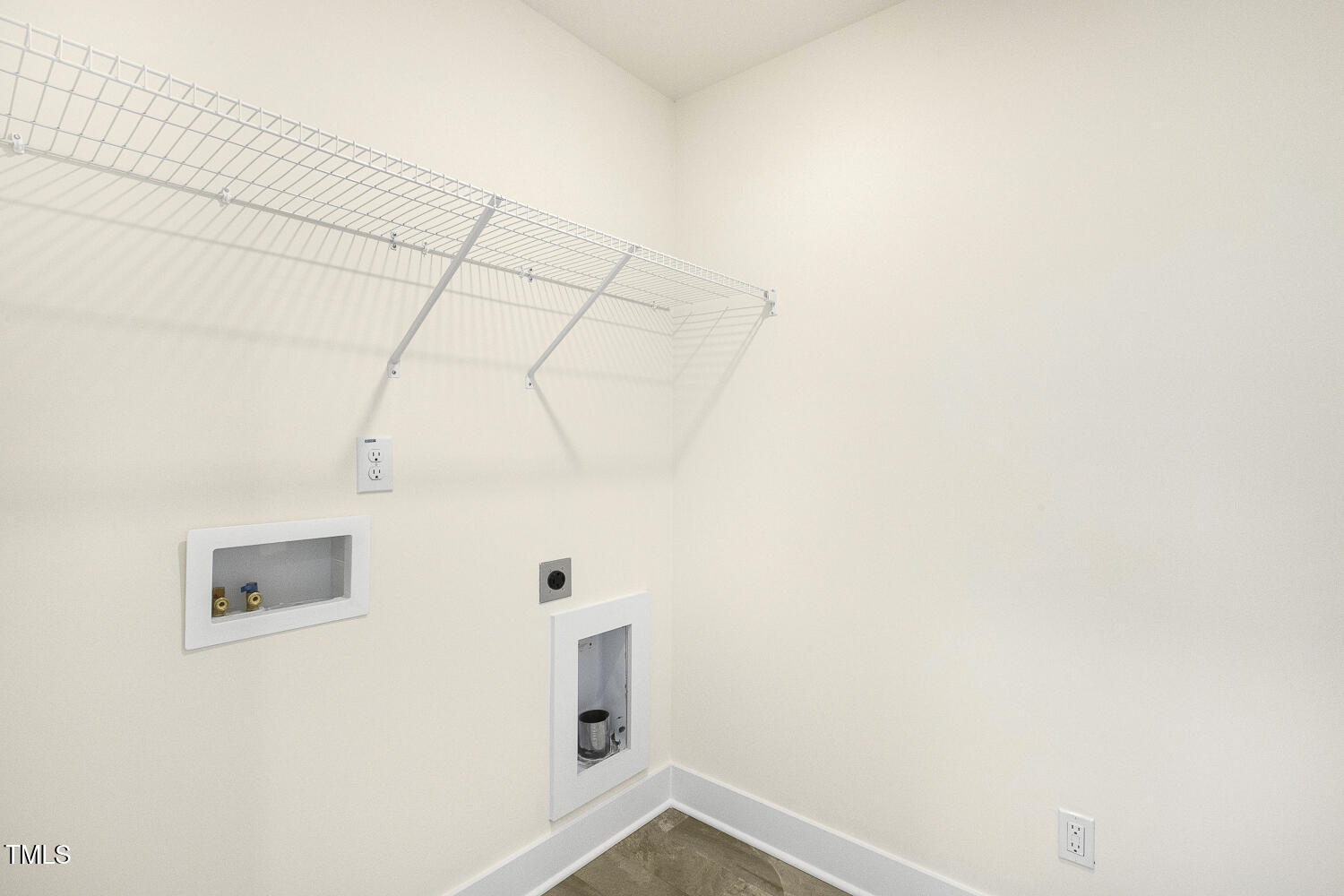 82 Gander Drive Benson, NC 27504 - Photo 21 of 33 a view of a utility room with racks on the wall