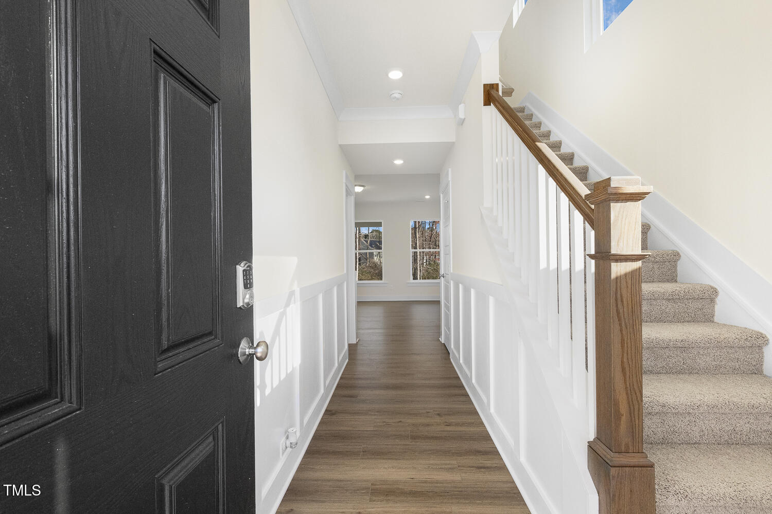 82 Gander Drive Benson, NC 27504 - Photo 3 of 33 a view of a hallway with wooden floor and staircase