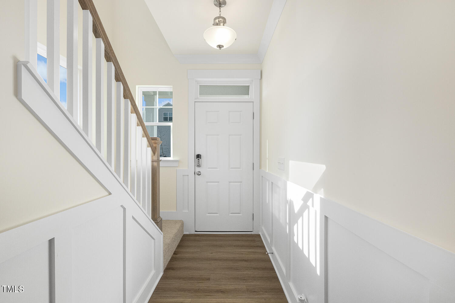 82 Gander Drive Benson, NC 27504 - Photo 4 of 33 a view of a hallway with wooden floor and staircase