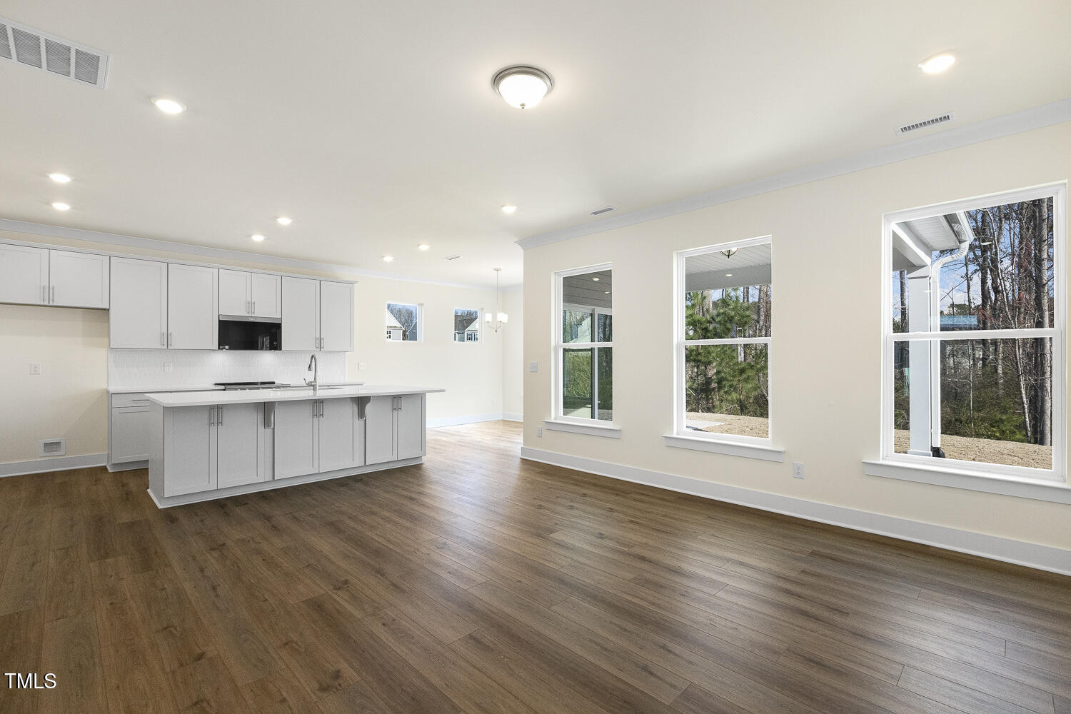 82 Gander Drive Benson, NC 27504 - Photo 6 of 33 a large kitchen with stainless steel appliances granite countertop a large counter top a wooden floors and a large window