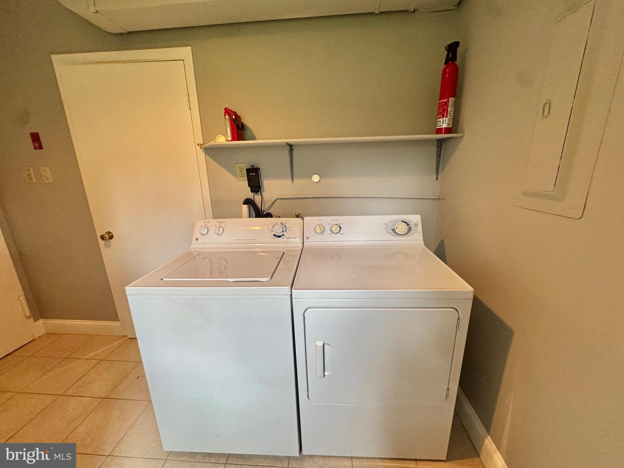 4908 Rocky Spring Lane Bowie, MD 20715 - Photo 15 of 36 a utility room with dryer and washer