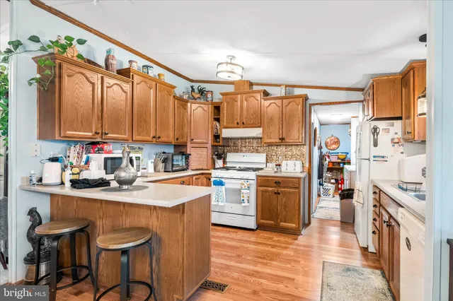 a kitchen with a refrigerator stove and sink