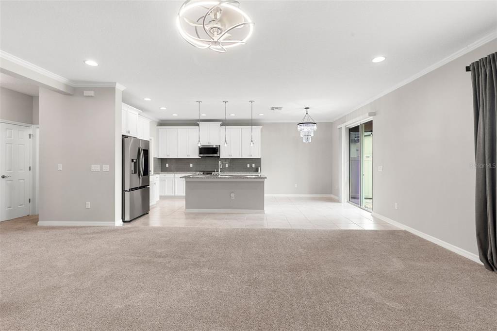 7537 Pool Compass Loop Wesley Chapel, FL 33545 - Photo 11 of 50 a view of a kitchen with a sink and cabinets