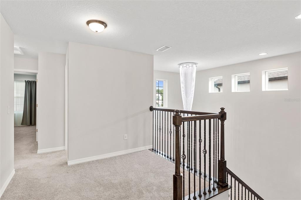 7537 Pool Compass Loop Wesley Chapel, FL 33545 - Photo 23 of 50 a view of a hallway with entryway door