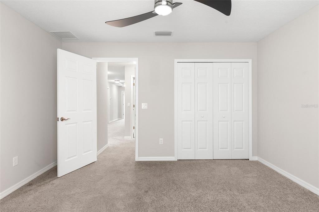 7537 Pool Compass Loop Wesley Chapel, FL 33545 - Photo 26 of 50 an empty room with fan