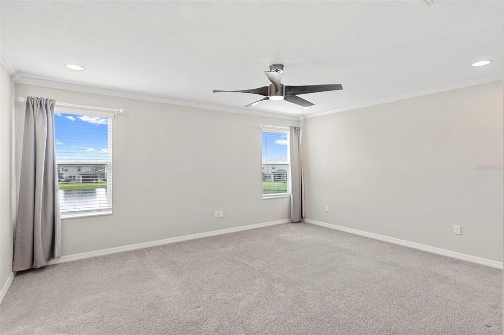 7537 Pool Compass Loop Wesley Chapel, FL 33545 - Photo 31 of 50 a view of an empty room with a window