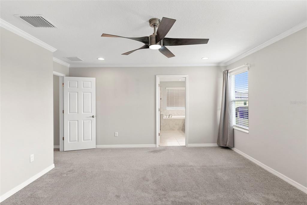7537 Pool Compass Loop Wesley Chapel, FL 33545 - Photo 33 of 50 a view of a livingroom with a ceiling fan and window