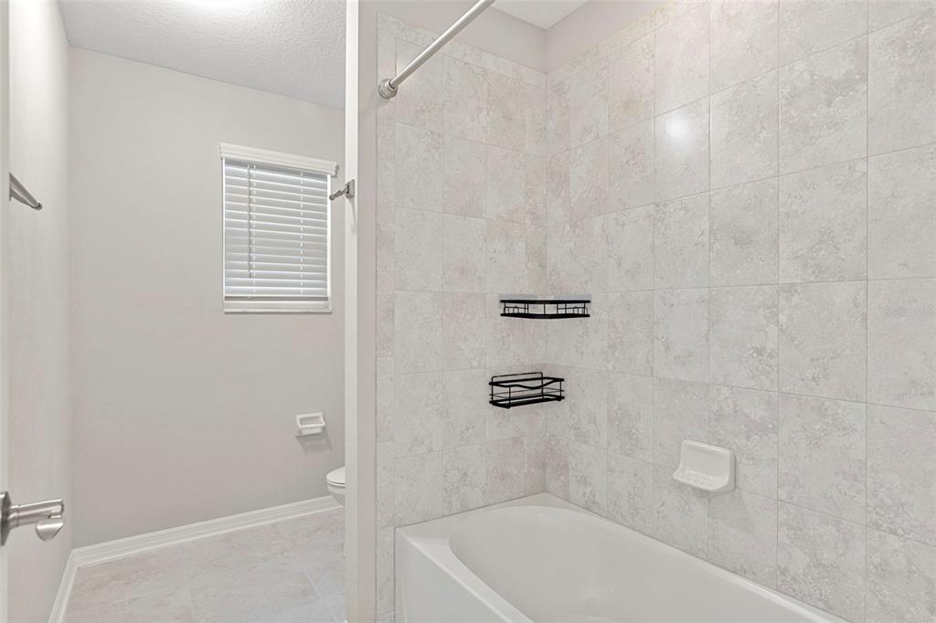 7537 Pool Compass Loop Wesley Chapel, FL 33545 - Photo 39 of 50 a bathroom with a bath tub