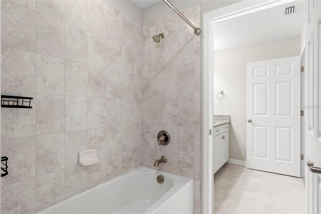 7537 Pool Compass Loop Wesley Chapel, FL 33545 - Photo 40 of 50 a bathroom with a bathtub