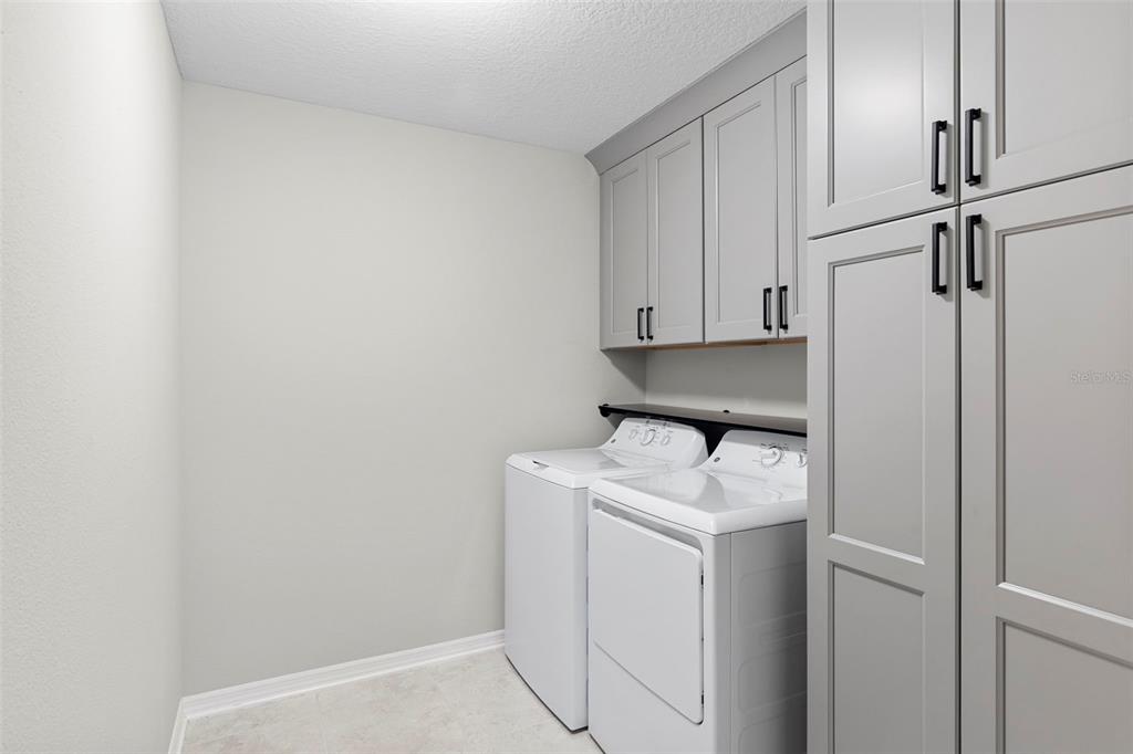 7537 Pool Compass Loop Wesley Chapel, FL 33545 - Photo 42 of 50 a utility room with dryer and washer